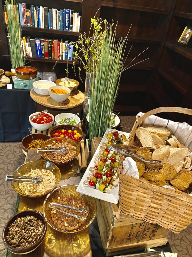 A buffet table with many different foods on it.