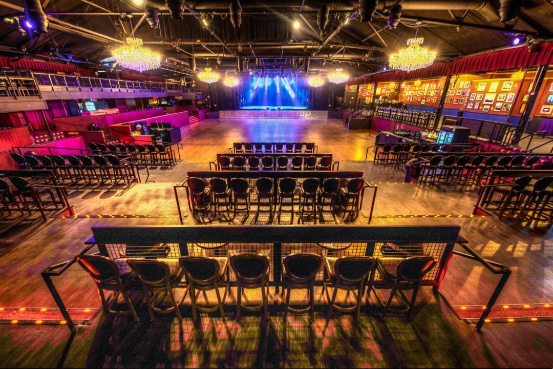 A large room with many chairs and tables